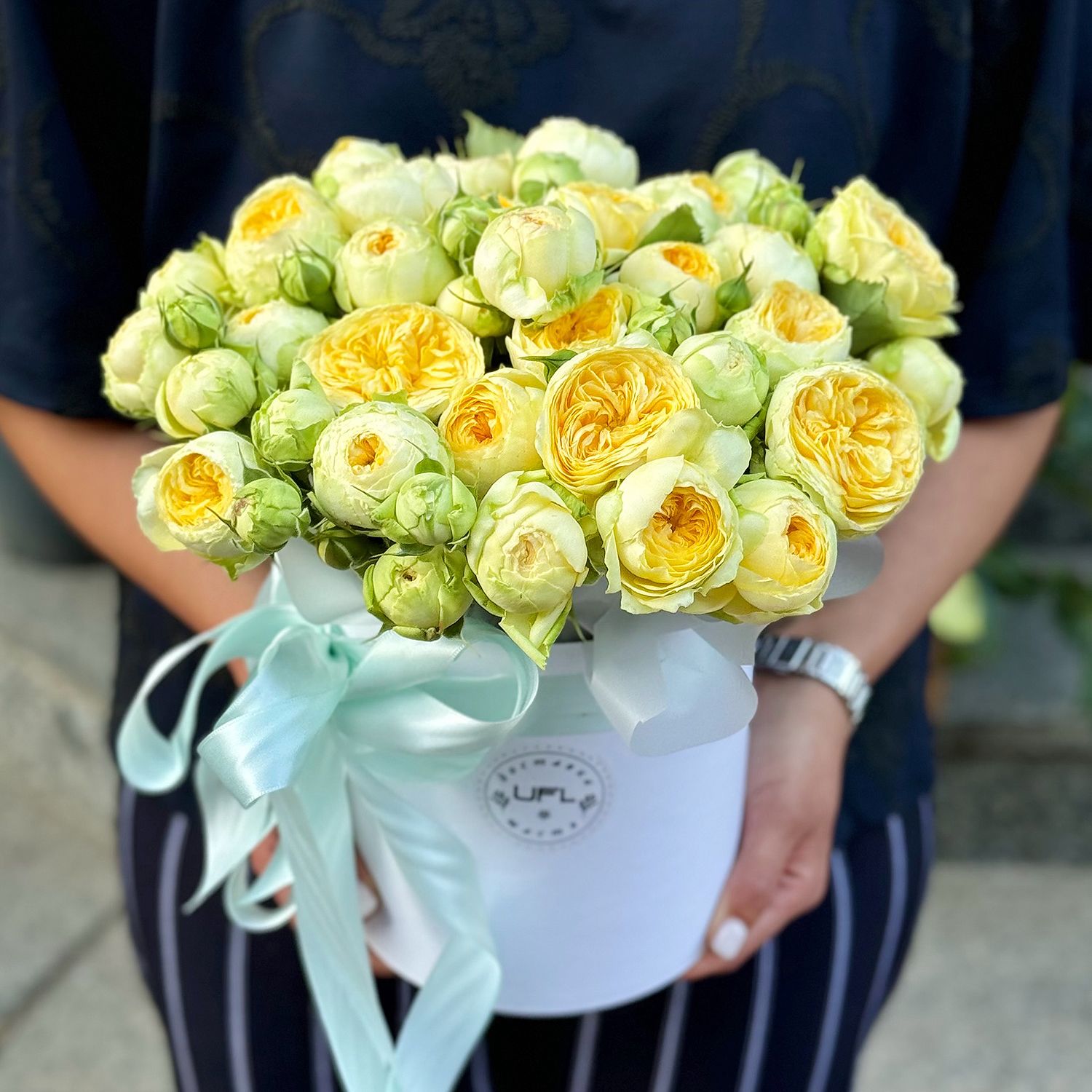 Yellow spray roses in a box