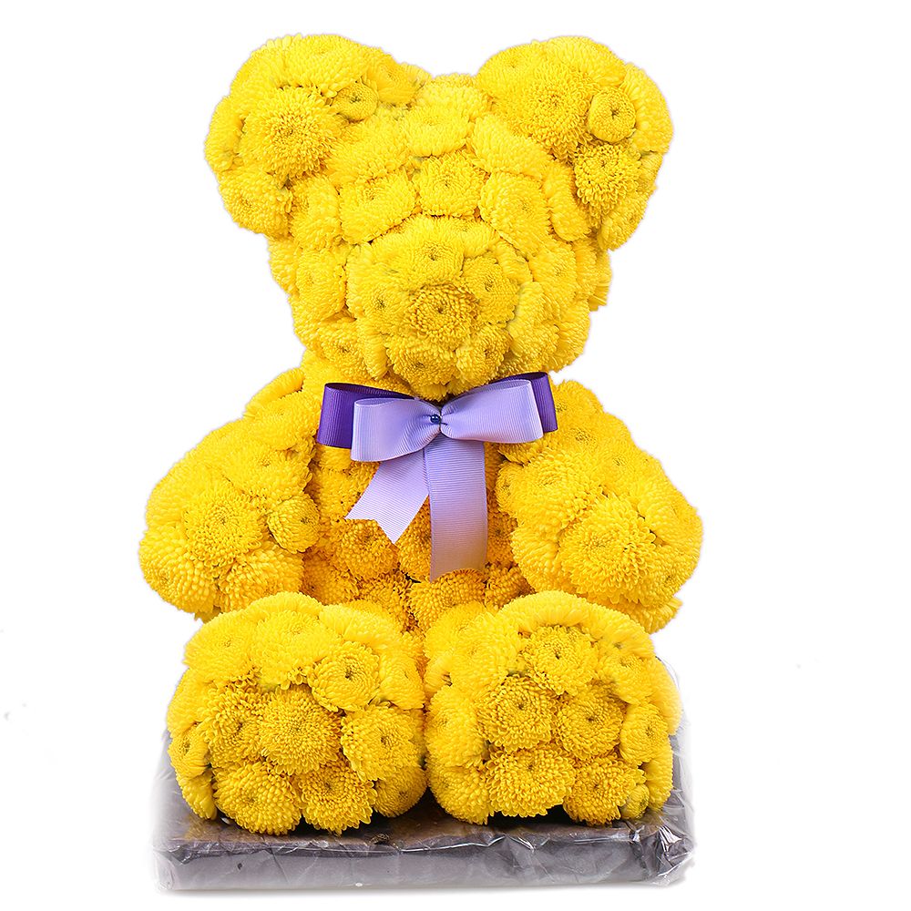 Yellow teddy with a tie-bow Yellow teddy with a tie-bow
