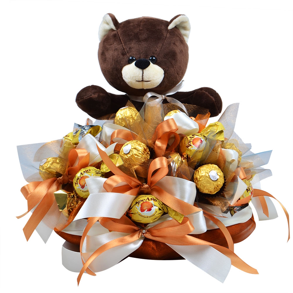 Arrangement of chocolates with teddy bear Arrangement of chocolates with teddy bear